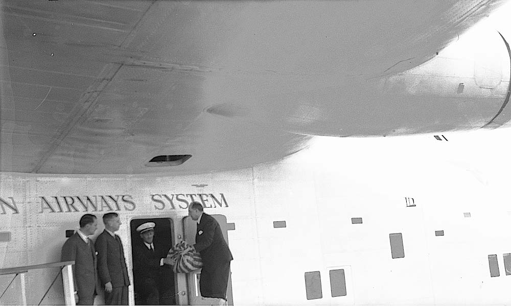 Juan Trippe (left) looks on as Capt. LaPorte receives mail on May 20, 1939 B-314 Yankee Clipper's first mail across the Atlantic