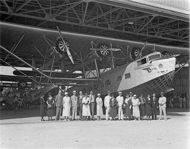 Newspaper group in front of Clipper at Dinner Key Miami Dade Public Library