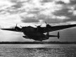 Pan Am Boeing 314 takes off at dawn during wartime, World War Two
